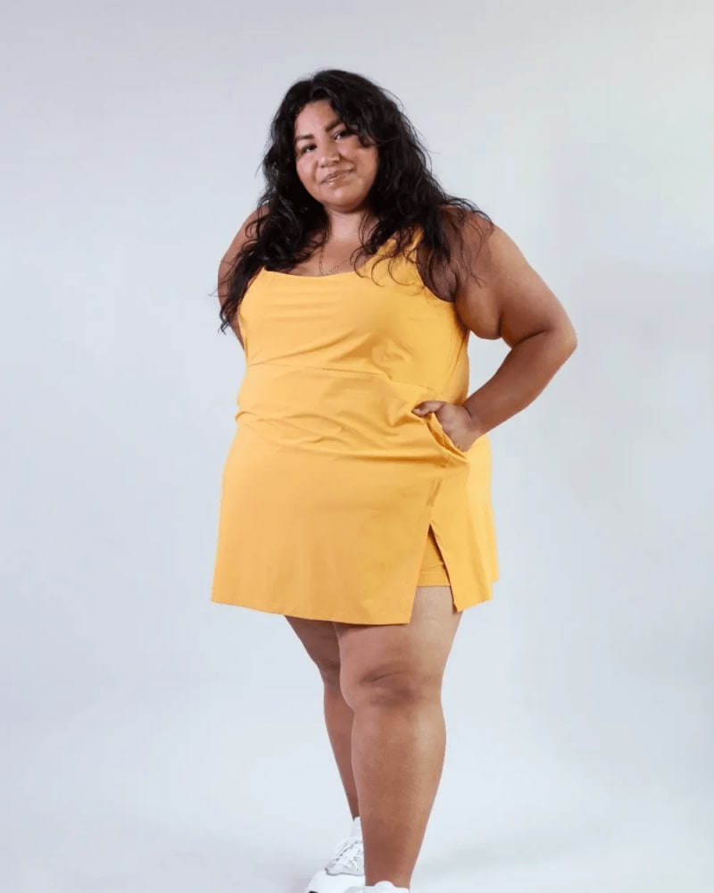 Front of a model wearing a size L get dirty dress in honey by alder apparel. | dia_product_style_image_id:300750